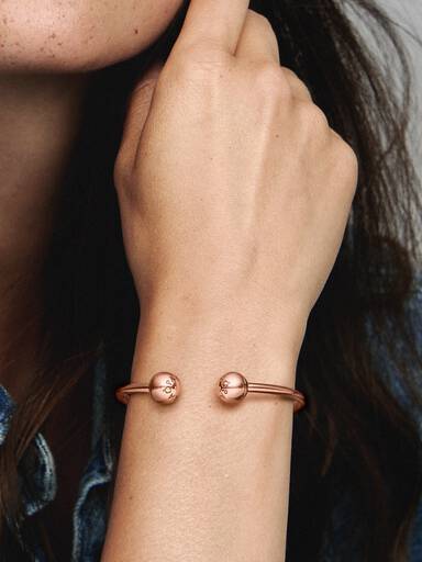 14k Rose gold-plated open bangle with silicone stoppers and interchangeable end caps