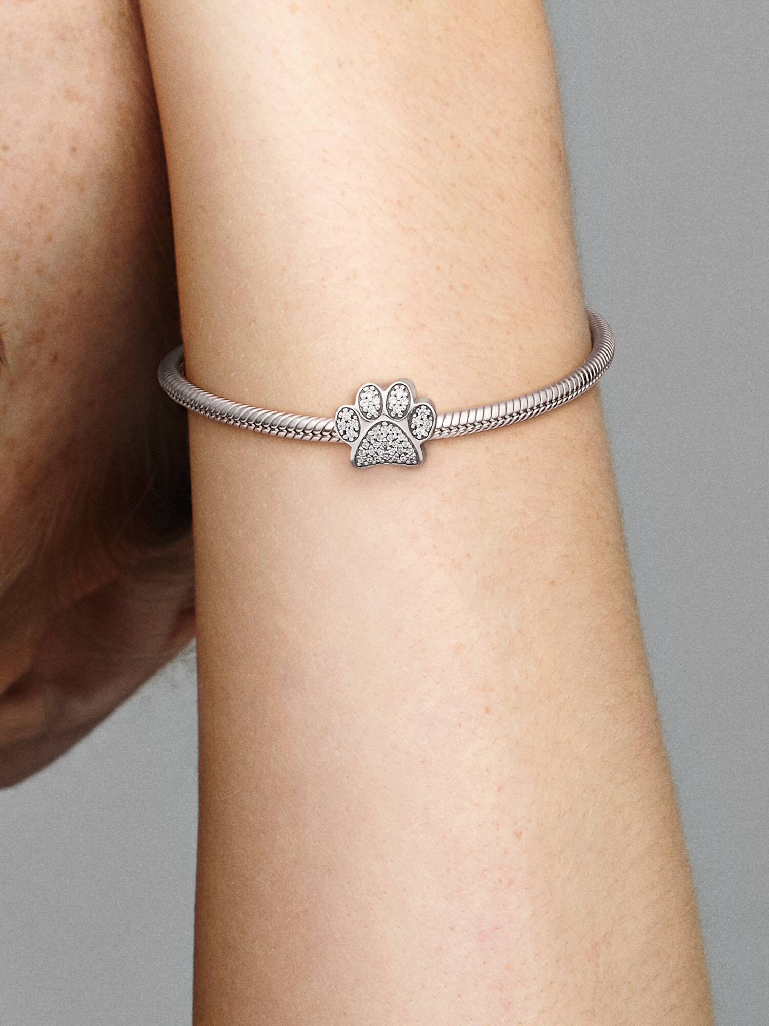 Paw silver charm with cubic zirconia