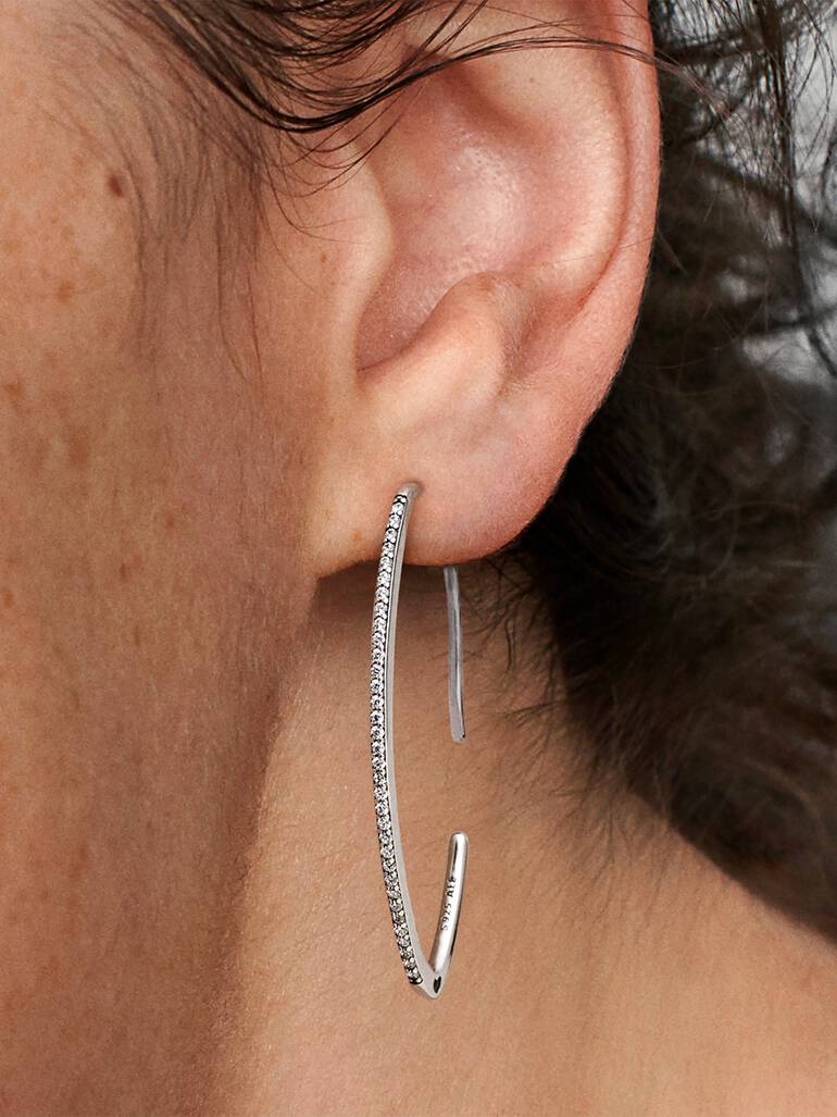 Silver oval hoop earrings with clear cubic zirconia