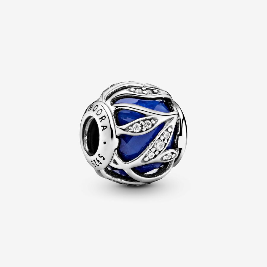 Abstract silver charm with faceted royal blue crystal and clear cubic zirconia image number 0