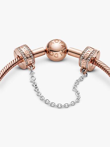 14k Rose gold-plated logo safety chain with clear cubic zirconia, silicone grip and silver chain