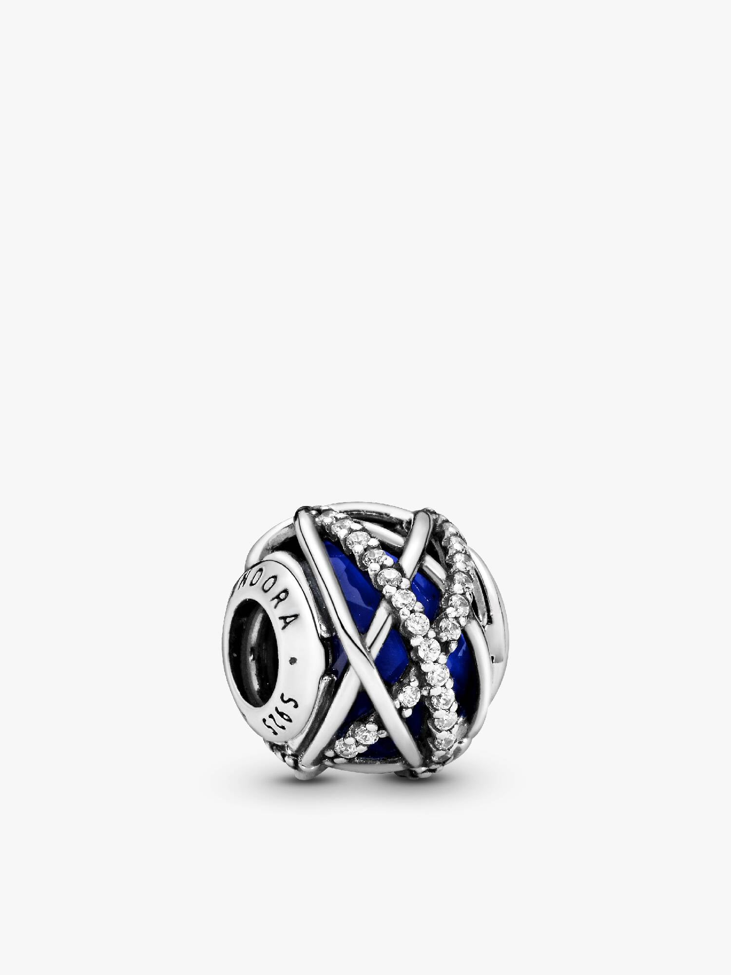 Abstract silver charm with royal blue crystal and clear cubic zirconia