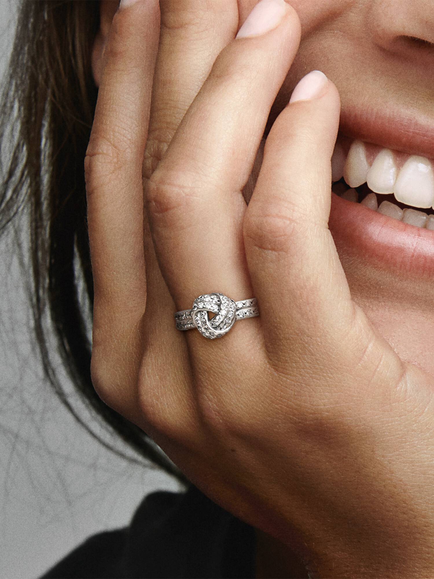 Love knot silver ring with clear cubic zirconia
